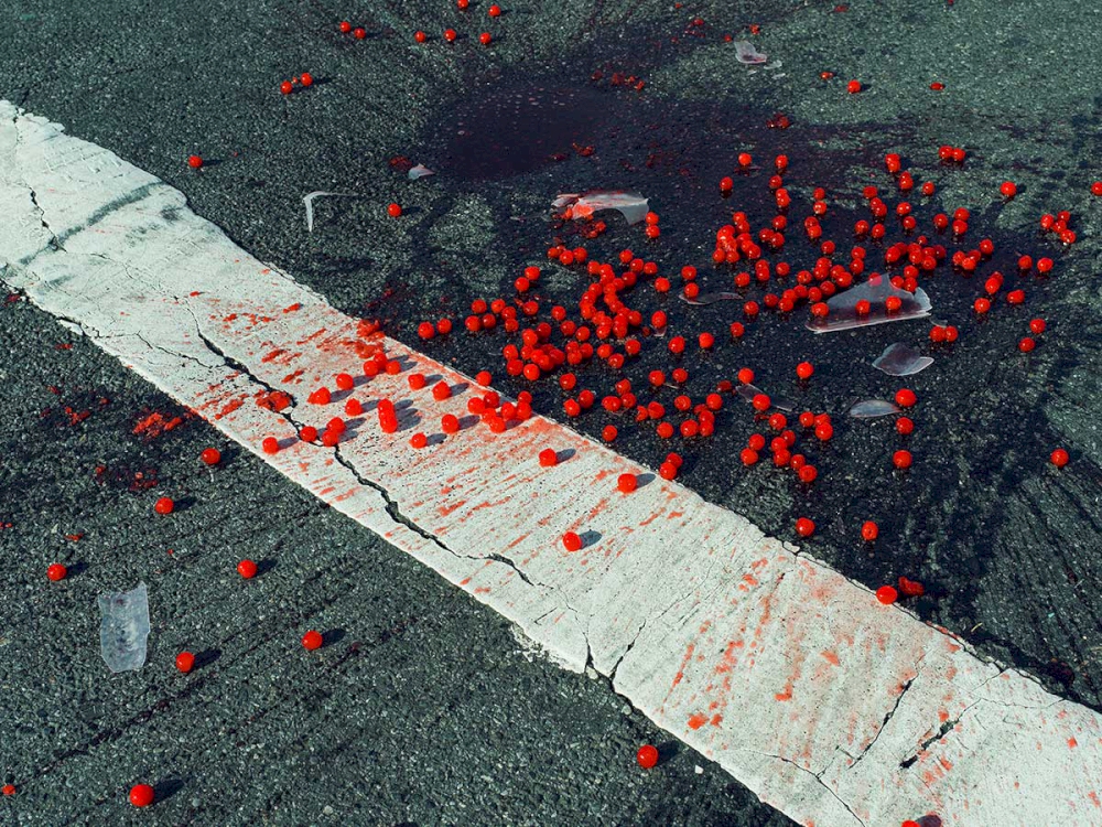 Cherries spilled on crosswalk, New York City, USA, 2014 © Christopher Anderson/Magnum Photos