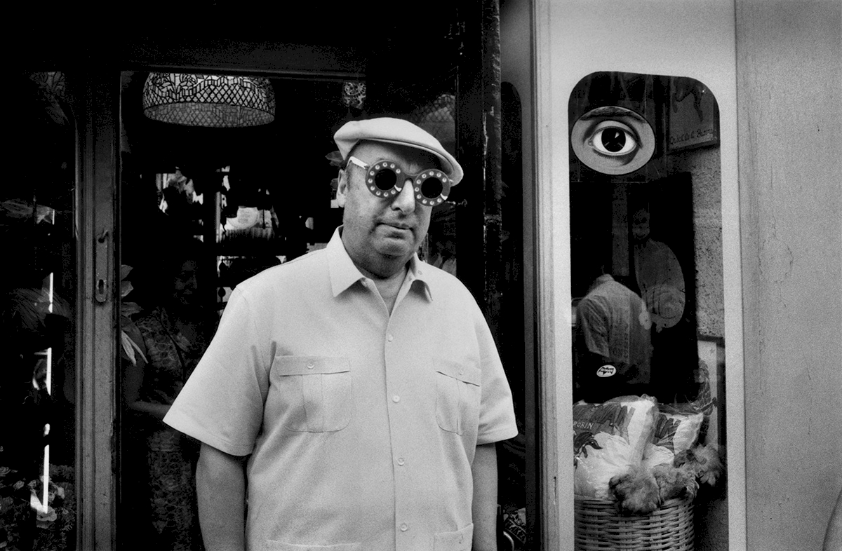 USA. New York, NY. Poet Pablo Neruda after buying funny glasses in a Greenwich Village boutique. 1966. © Inge Morath / Magnum Photos / courtesy CLAIRbyKahn